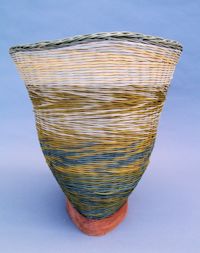 cedar base and dyed reed wicker basket by Judy